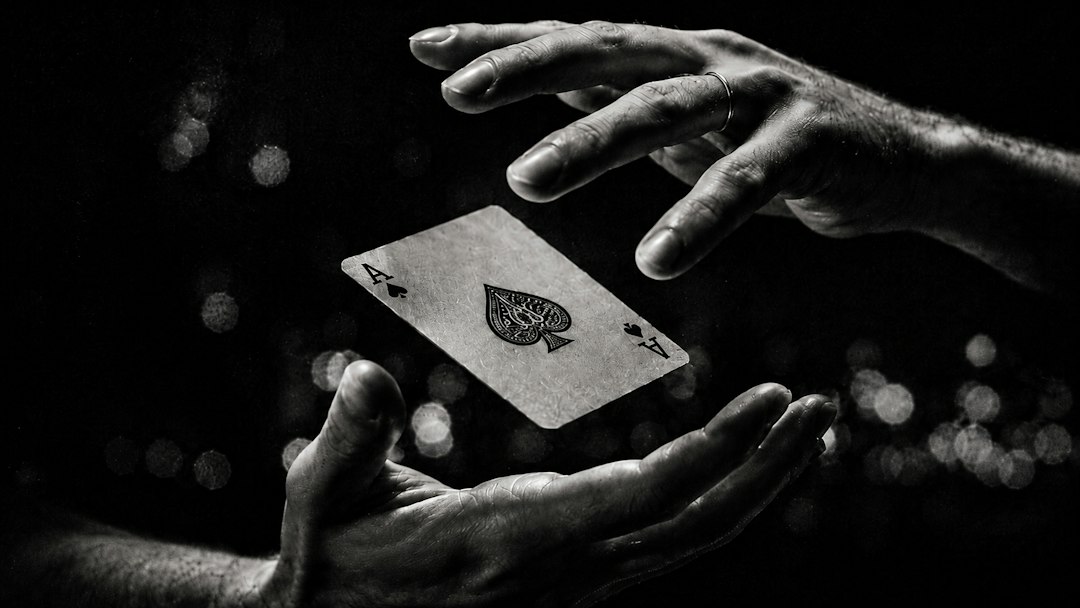 magicians-hands-levitating-an-ace-of-spades-playing-card-c3xnoicajpq